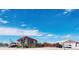 Welcoming ranch style home with a charming front porch and well manicured yard perfect for relaxing outdoors at 16659 County Road 4, Brighton, CO 80603