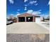 Spacious garage with multiple bays, offering plenty of room for vehicles, storage, and various equipment at 16659 County Road 4, Brighton, CO 80603