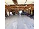 Spacious garage with overhead wood beam structure, offering substantial space for storage and various projects at 16659 County Road 4, Brighton, CO 80603
