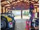 Overhead view of a well-organized garage with a vehicle, storage solutions, and tools, offering plenty of workspace at 16659 County Road 4, Brighton, CO 80603