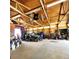 Spacious garage workshop with overhead storage, ample lighting, and tools, ideal for hobbyists or car enthusiasts at 16659 County Road 4, Brighton, CO 80603