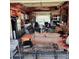 Open garage with kitchenette, living area, and work space, offering versatility at 16659 County Road 4, Brighton, CO 80603