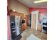 This is a kitchen with stainless steel refrigerator and a gas stove at 16659 County Road 4, Brighton, CO 80603
