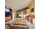 Comfortable living room with a vaulted ceiling, a patterned rug, and a cozy sofa at 16659 County Road 4, Brighton, CO 80603