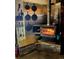 A charming wood burning stove is accented by cooking tools at 16659 County Road 4, Brighton, CO 80603