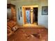 Bedroom leading to an ensuite bath and closet, providing convenience and functionality at 16659 County Road 4, Brighton, CO 80603