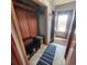 Mudroom area with a bench, storage, and tile flooring, providing a practical entry space at 16659 County Road 4, Brighton, CO 80603