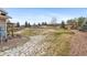 Wide open backyard featuring a fence, lots of grass, landscaping and rock, and beautiful views at 24608 E Moraine Pl, Aurora, CO 80016