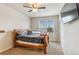 This bedroom features a ceiling fan, window, television and closet at 24608 E Moraine Pl, Aurora, CO 80016