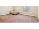 Cozy bedroom with neutral carpet, a single bed, and natural light from the window at 24608 E Moraine Pl, Aurora, CO 80016