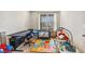 This bedroom features a window, carpet, and plenty of toys at 24608 E Moraine Pl, Aurora, CO 80016