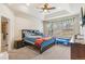 This bedroom features a ceiling fan, window, tray ceiling and carpet at 24608 E Moraine Pl, Aurora, CO 80016