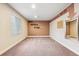 Spacious bonus room with motivational decor, neutral carpet, and natural light from the window at 24608 E Moraine Pl, Aurora, CO 80016