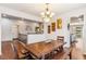 Cozy dining room with a rustic wooden table and a chandelier at 24608 E Moraine Pl, Aurora, CO 80016