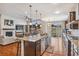 Large kitchen featuring a center island, stainless steel appliances, and an open floorplan at 24608 E Moraine Pl, Aurora, CO 80016