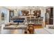 Living space showcasing a kitchen with dark wood cabinets and a large island with bar seating at 24608 E Moraine Pl, Aurora, CO 80016