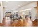 Open-concept living space featuring hardwood floors, recessed lighting, and an inviting dining area at 24608 E Moraine Pl, Aurora, CO 80016