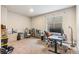 Bright office space featuring modern desk setup, neutral carpet, and a comfortable work environment with plenty of storage at 24608 E Moraine Pl, Aurora, CO 80016