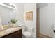 Well-lit bathroom with a granite vanity, decorative accents, and a clean, modern design at 7719 Everett Way, Arvada, CO 80005