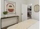 Stylish bedroom with modern decor, an open door, and a glimpse of the home's interior at 7719 Everett Way, Arvada, CO 80005