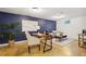 Versatile bonus room with a home office setup and comfortable seating area for relaxation or work at 7719 Everett Way, Arvada, CO 80005