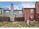 Back exterior view of the property, showcasing its two-story layout and color palette at 14272 E Hawaii Cir # B, Aurora, CO 80012