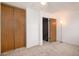 Bedroom with closet and access to the hallway to the right at 14272 E Hawaii Cir # B, Aurora, CO 80012
