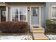Charming townhome front entrance featuring yellow steps and house number above the door at 14272 E Hawaii Cir # B, Aurora, CO 80012