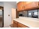 Kitchen counter leading to a view of the living room with access to the bathroom at 14272 E Hawaii Cir # B, Aurora, CO 80012