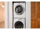 Stackable washer and dryer tucked in the laundry closet at 14272 E Hawaii Cir # B, Aurora, CO 80012
