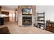 Bright living room featuring a stone fireplace and open layout at 14272 E Hawaii Cir # B, Aurora, CO 80012