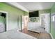 Green bedroom with ensuite bathroom, offering comfort and convenience at 450 Yukon St, Lakewood, CO 80226