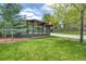 Well-manicured front yard with lush green grass and stylish modern home exterior at 450 Yukon St, Lakewood, CO 80226
