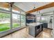 Bright kitchen with island seating, stainless appliances, and a chalkboard wall, all with abundant natural light at 450 Yukon St, Lakewood, CO 80226