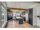 Modern kitchen featuring stainless steel appliances, a center island with seating, and a chalkboard wall at 450 Yukon St, Lakewood, CO 80226