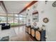 Spacious living room features hardwood floors, large windows, and stylish decor, offering ample natural light at 450 Yukon St, Lakewood, CO 80226