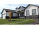 Charming two-story home with a well-manicured front yard, stone accents, and a two-car garage at 56315 E 74Th Ave, Strasburg, CO 80136