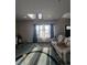 A living room featuring a seating area and hardwood floors at 56315 E 74Th Ave, Strasburg, CO 80136