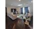 A living room featuring a seating area with hardwood floors at 56315 E 74Th Ave, Strasburg, CO 80136