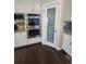 A kitchen with white cabinets, stainless steel appliances and fixtures, and a pantry at 56315 E 74Th Ave, Strasburg, CO 80136