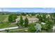 Scenic aerial view showcasing the expansive property with lush greenery and mountain views at 5653 Yank St, Arvada, CO 80002