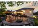 Backyard patio with fire pit, comfortable seating and pergola provides a relaxing outdoor space at 5653 Yank St, Arvada, CO 80002
