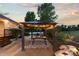 Backyard gazebo with string lights offers a dining area and serene outdoor living space at 5653 Yank St, Arvada, CO 80002