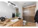 Modern bathroom features granite counters, double sinks and large glass enclosed shower at 5653 Yank St, Arvada, CO 80002