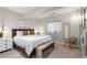 Well-lit bedroom with modern decor features a decorative bench and ambient lighting at 5653 Yank St, Arvada, CO 80002