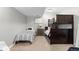 Comfortable bedroom features a twin bed and a bunk bed plus neutral paint and carpeting at 5653 Yank St, Arvada, CO 80002