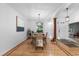 Bright dining room featuring stylish chairs, lighting fixture, and natural light at 5653 Yank St, Arvada, CO 80002