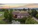 Charming one-story home boasts a beautiful yard, mature trees and mountain views in the distance at 5653 Yank St, Arvada, CO 80002