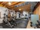 Spacious home gym with weightlifting equipment, cardio machines, and plenty of room for exercise at 5653 Yank St, Arvada, CO 80002