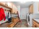 Well-organized mud room with built-in cabinets, a bench, and plenty of storage for outdoor gear at 5653 Yank St, Arvada, CO 80002